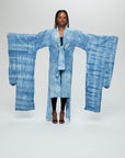 Akira Jacket Description - 100% cotton, knee length, flared sleeves front tie Color - Indigo arashi shibori dyed front view with arms art