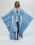 Akira Jacket Description - 100% cotton, knee length, flared sleeves front tie Color - Indigo arashi shibori dyed front view