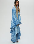 Akira Jacket Description - 100% cotton, knee length, flared sleeves front tie Color - Indigo arashi shibori dyed side view