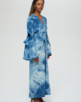 AOI Jacket Description - 100% cotton jacket v-neck, architectural long sleeve, front tie Color - Indigo arashi shibori dye side view