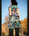 Carissa Vest Description - Vest 100% RECLÉM cotton thigh-length, sleeveless, large shawl collar wrap Color - Multi color Size - one size fits all back view