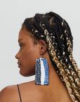 Emma large blue white earrings on model