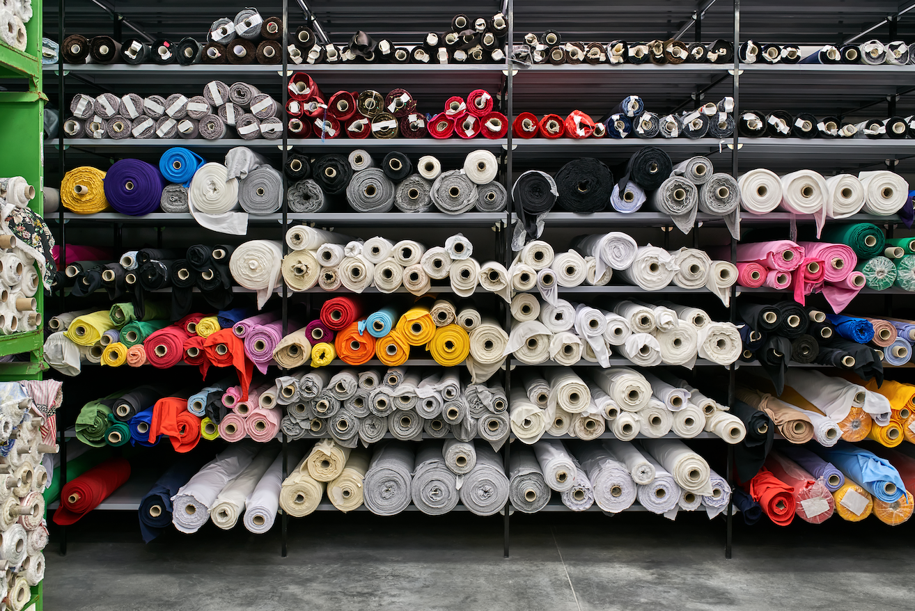 Rolls of fabric in a shelf at a fabric warehouse