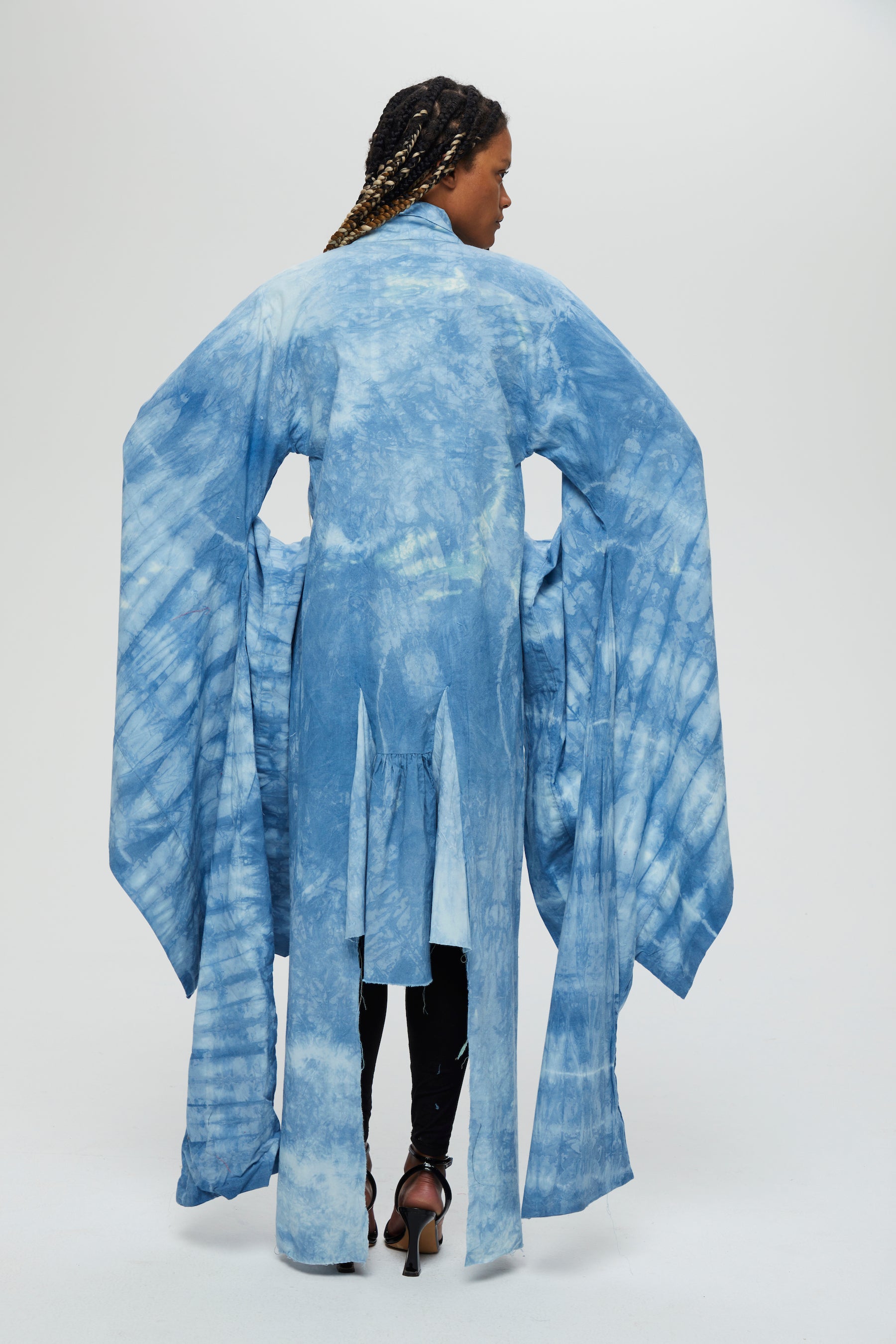 Akira Jacket Description - 100% cotton, knee length, flared sleeves front tie  Color - Indigo arashi shibori dyed  back view