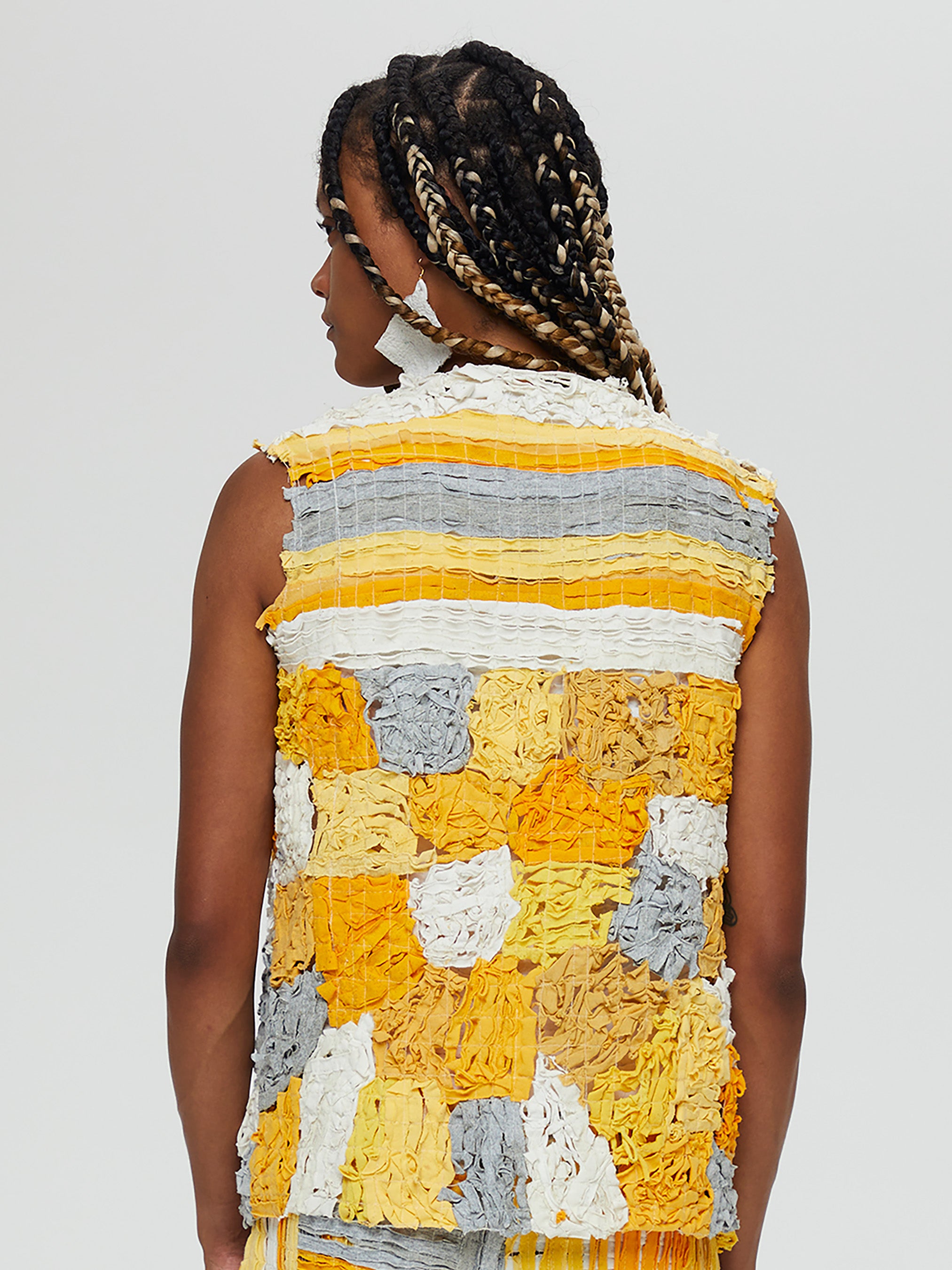 Clara 3 Vest Description - Vest 100%   RECLÉM cotton , boxy, sleeveless, tie front  Color - Yellow, grey and white back view