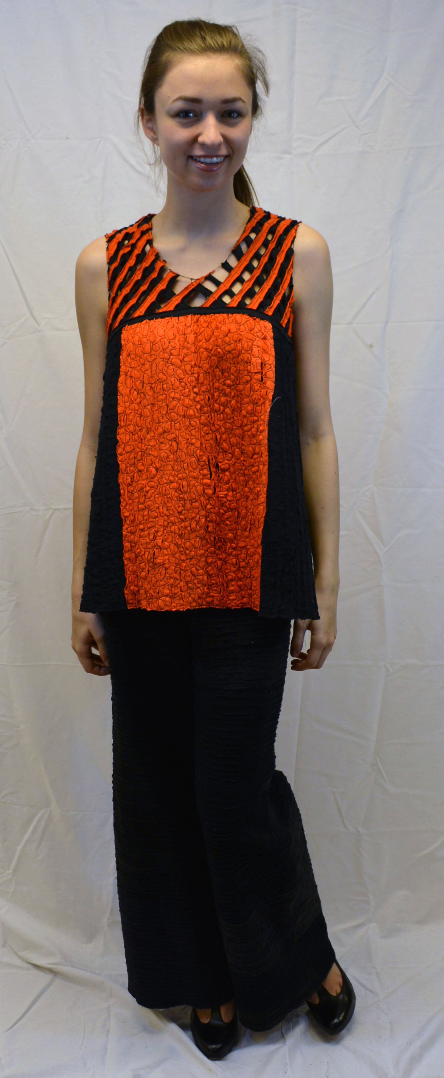 sleeveless black and orange reclem top on model