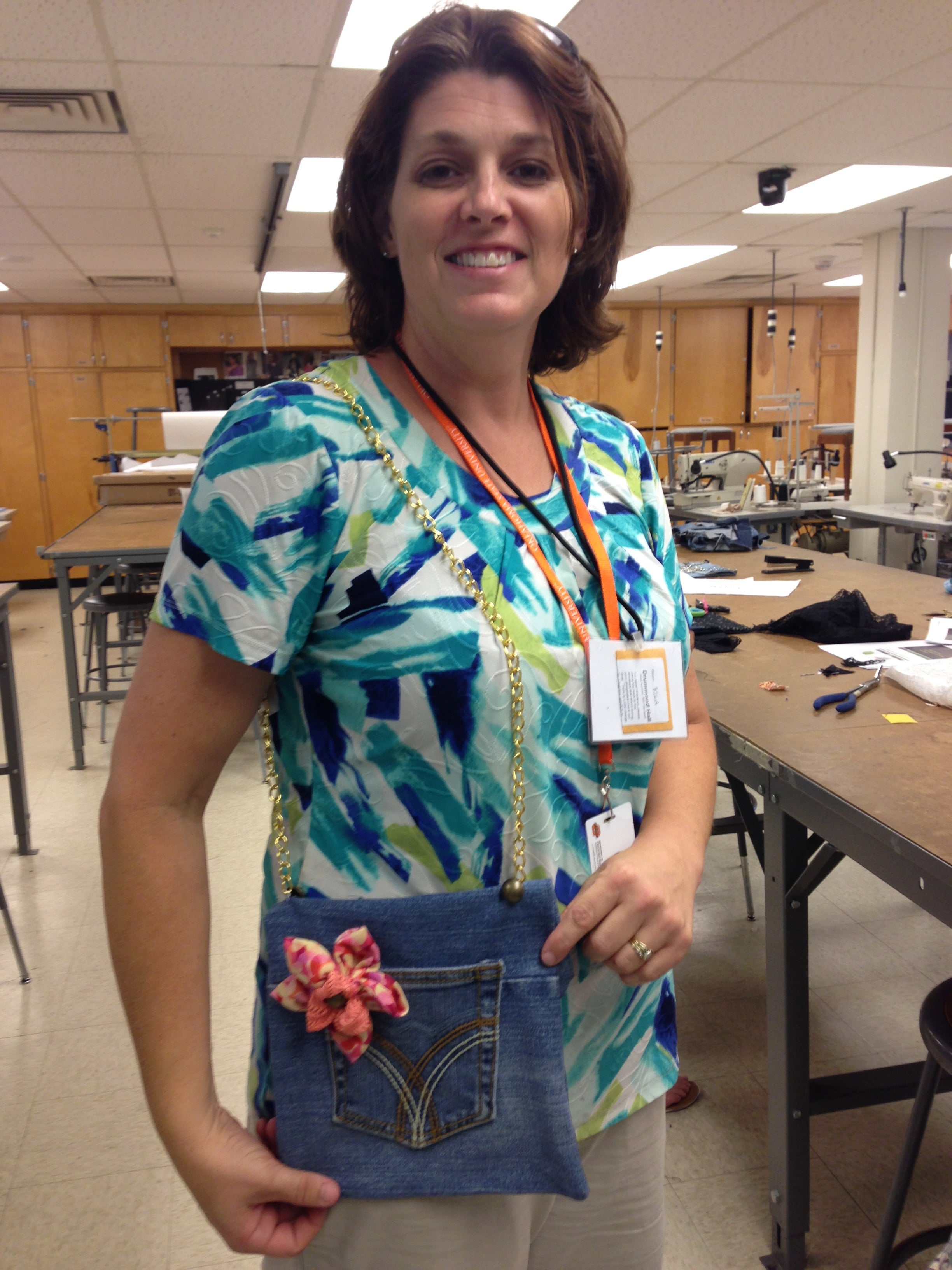 Women showing off handmade denim purse