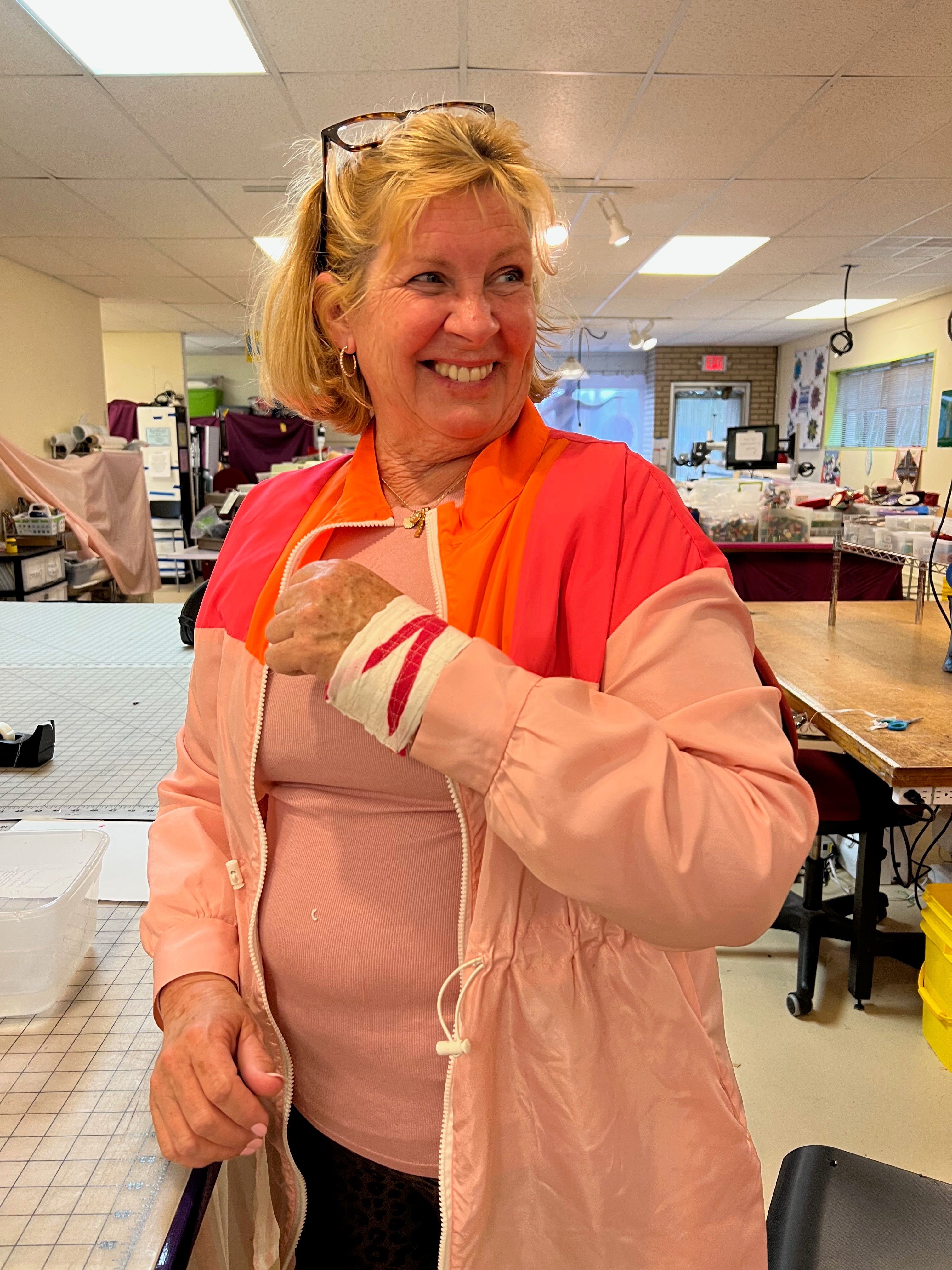 Woman showing off reclem arts and crafts during workshop